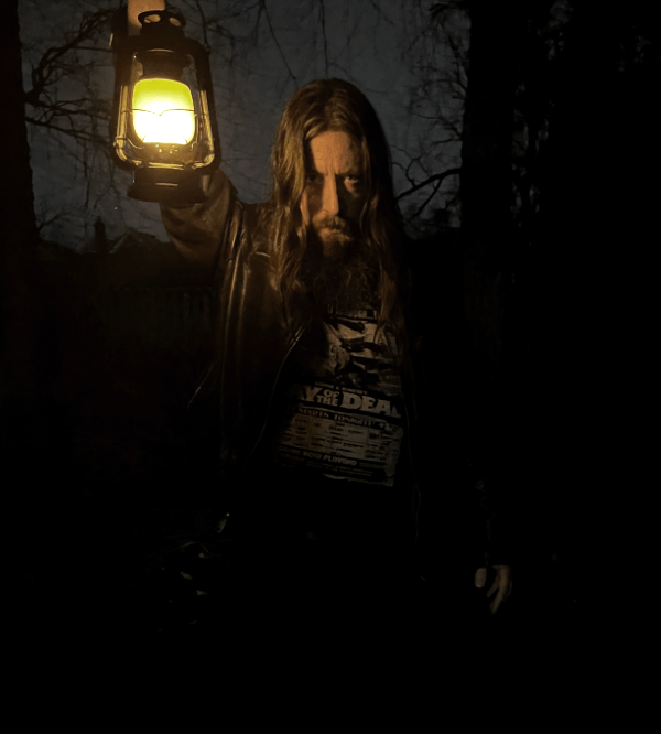 Middle aged bearded man with a lantern